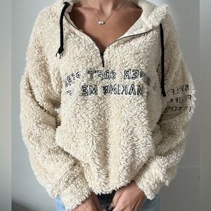 Fluffy jacket with a hood in a cream color